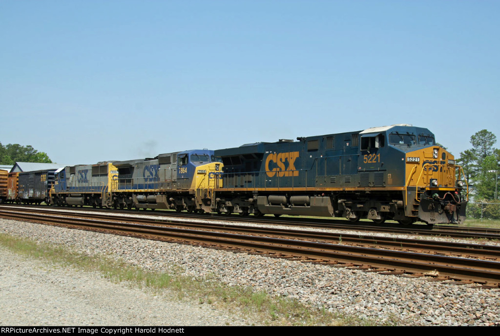 CSX 5221 leads train Q410 northbound, out of the yard